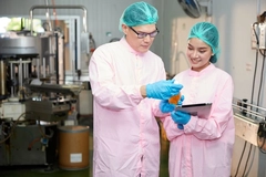 Image Factory workers checking a fiber beverage