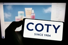 Image Coty on a phone with a webpage in the background.