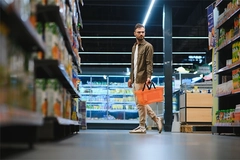 Image Man shopping in supermarket.