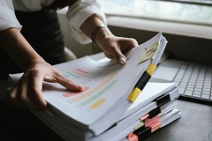 Image Hands holding documents.