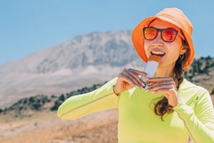 Image Asian woman eating protein bar