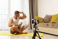Image Fitness blogger streaming or recording video for his subscribers