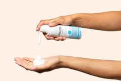 A Honey Pot product being pumped into hands.