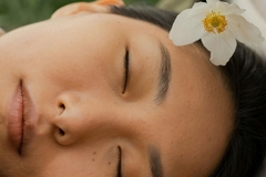 Image women lies peacefully with eyes closed