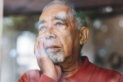 older man looking out the window older man looking out the window