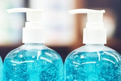 Image A close-up of a couple of blue liquid bottles