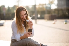 Image Young woman eating chocolate.