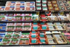 Plant-based meat on supermarket shelf.