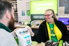 Image A person and person at a store