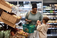 Overweight woman shopping for vegetables