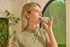 Woman drinking Magic Mind beverage Woman drinking Magic Mind beverage