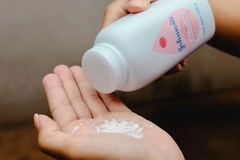 Image J&J baby powder in someone's hand