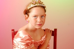 Image yiung girl looks sad in a pageant dress