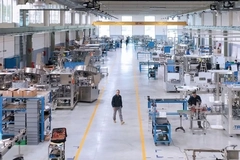 Image A man walking in a facility.