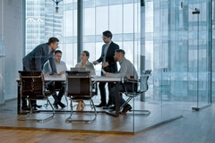 Business people in a nice office doing business stuff.