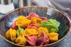 Colorful Chinese dumplings in an earthenware bowl in China.