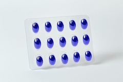 A close-up of a blister pack of blue pills