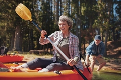 Image Healthy active senior in a kayak