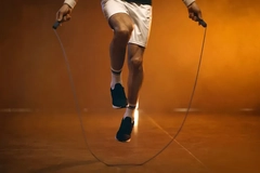 Image man working out with jumping ropes