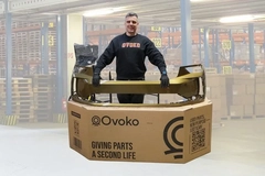Image A person standing in a large cardboard box