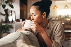 Image Relaxed woman drinking tea