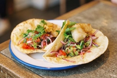 Image white fish taco on blue plate