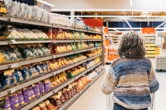 Image older woman shopping in supermarket