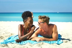 Two people lying on the beach. Two people lying on the beach.