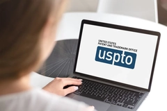 USPTO website woman searching for patent
