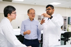 Image A group of men in lab coats
