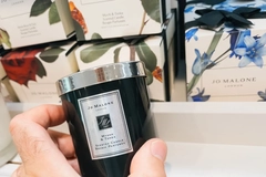 Image Jo Malone candle being held in-store