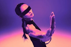 Image Woman with futuristic glasses in a neon room