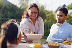 Image Family eating dinner.