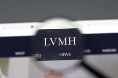 Image LVMH logo on a computer screen under a magnifying glass
