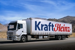A Kraft Heinz semi-truck driving through the desert. A Kraft Heinz semi-truck driving through the desert.