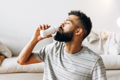 Man drinking probiotic dairy beverage