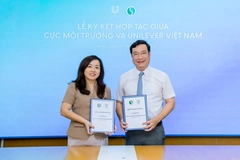 Two people smiling into the camera