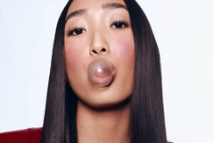 Woman blowing a bubble with gum