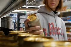 Image Girl chooses can from aisle