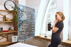 Image woman checking nutritional data on large screen