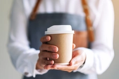 Image A person holding a coffee cup
