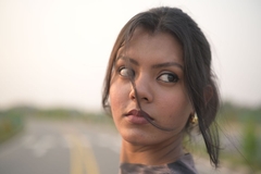Image young woman looks off camera