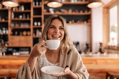 Image Woman drinking coffee in café