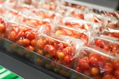 Image A close-up of plastic bags of tomatoes