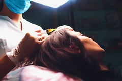 Image Woman getting injection for hair growth.